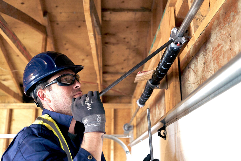 Expert garage door spring repair services in San Antonio TX, fixing torsion and extension springs for smooth door operation.