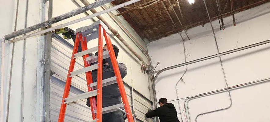 Comprehensive commercial garage door maintenance in San Antonio, including inspection, lubrication, and adjustments for long-term reliability.