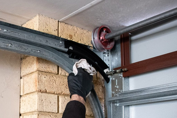 Comprehensive garage door roller maintenance in San Antonio, including lubrication, cleaning, and inspections for long-lasting performance.